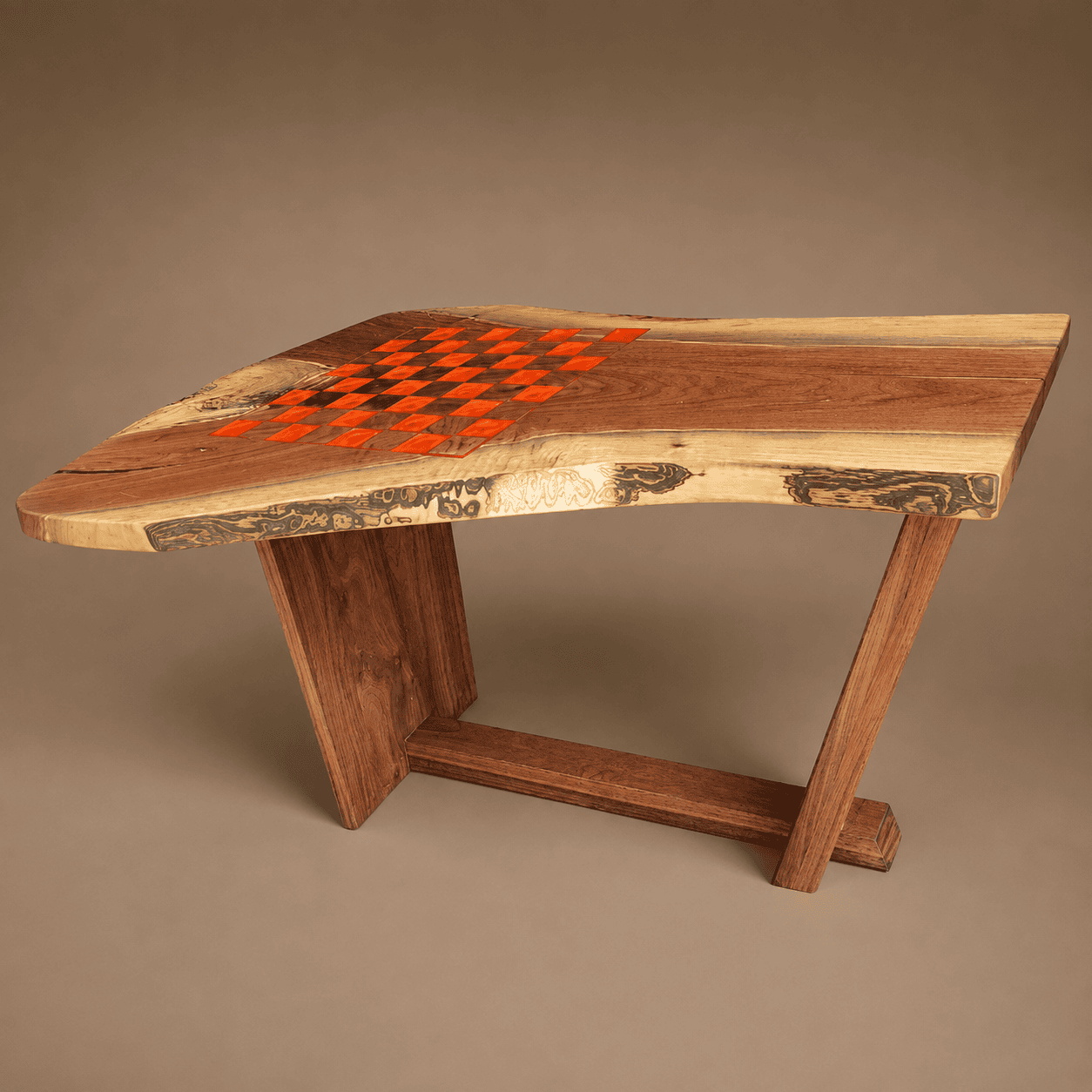 Solid walnut live edge chess table with orange resin checkerboard and handcrafted wooden base