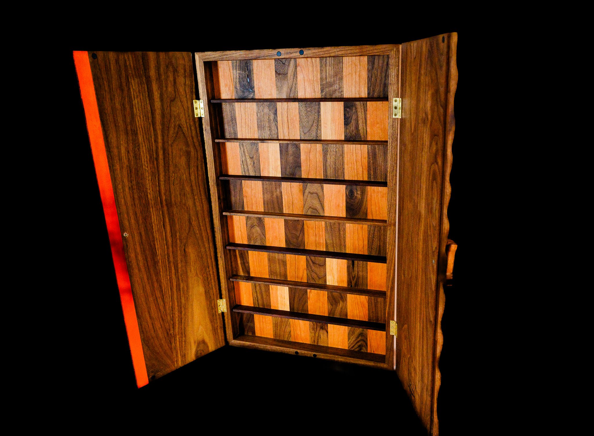 Open solid walnut chessboard showing contrasting wood playing squares